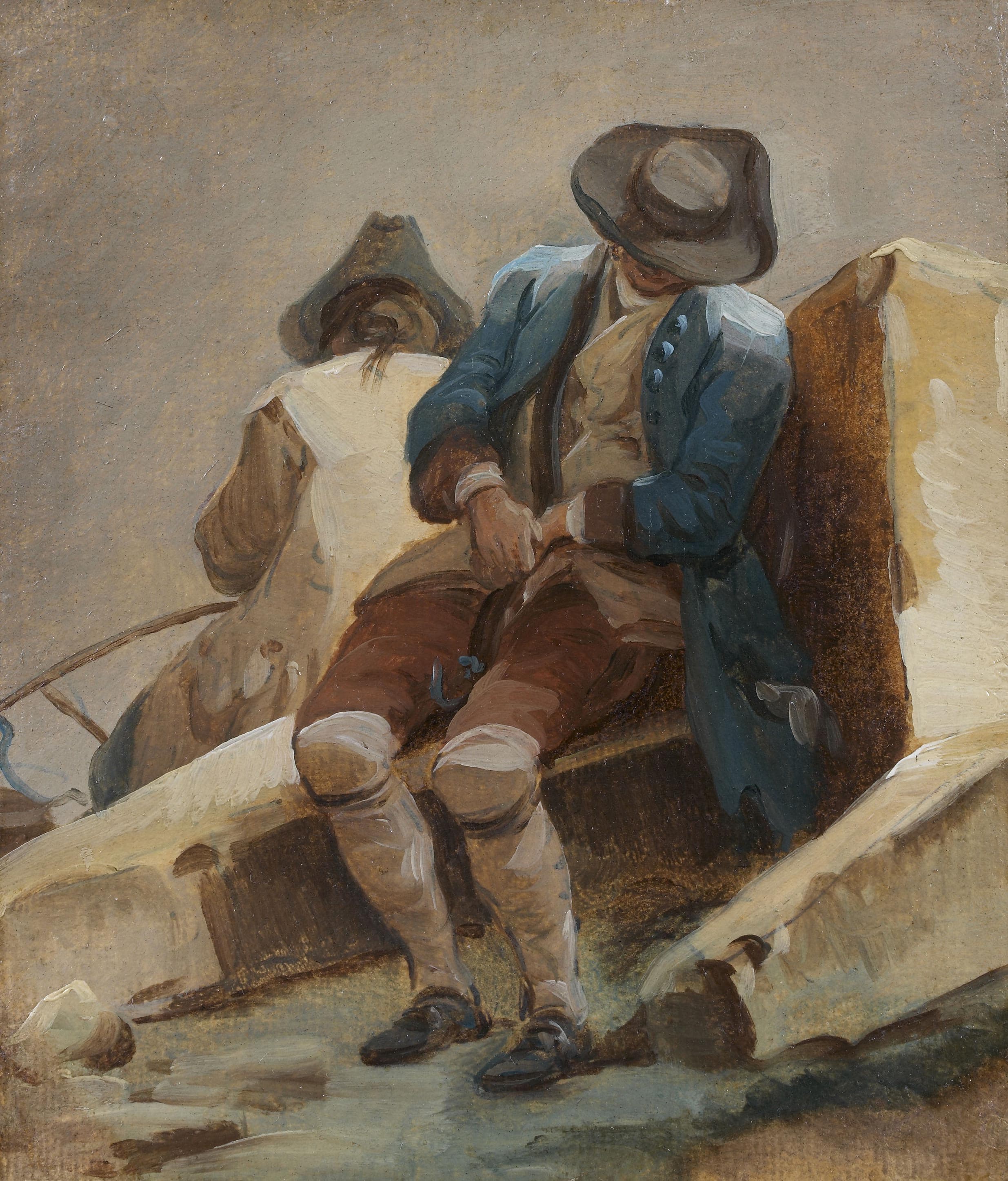 Deux hommes assis sur des blocs de pierre