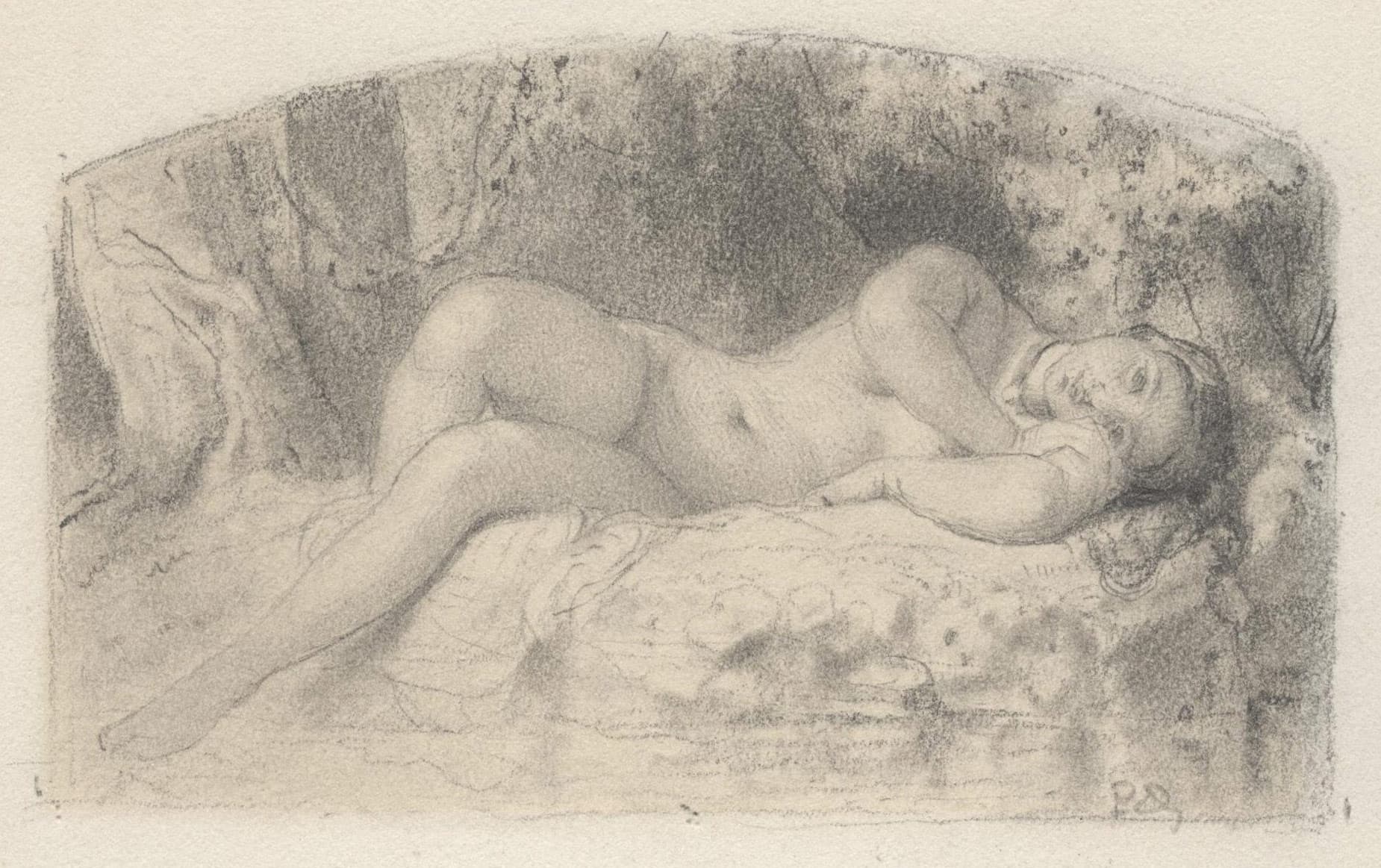 Young woman lying beside the water's edge in an undergrowth